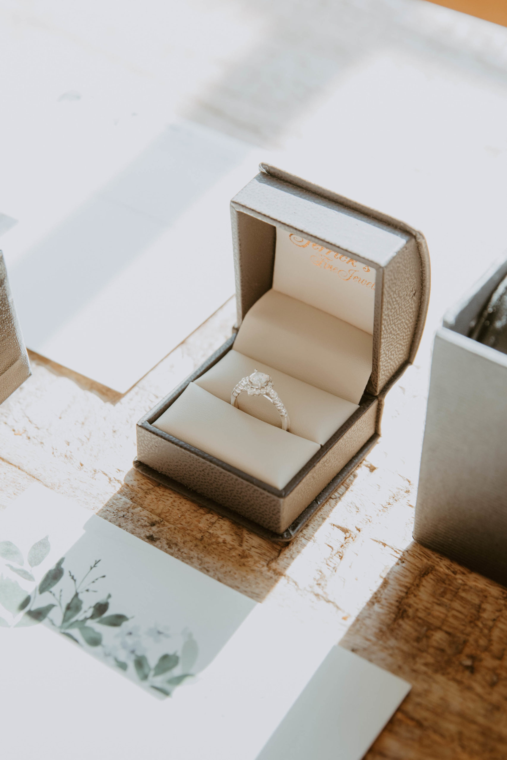 Diamond ring displayed inside of a ring box referencing mistakes to avoid when wedding planning.
