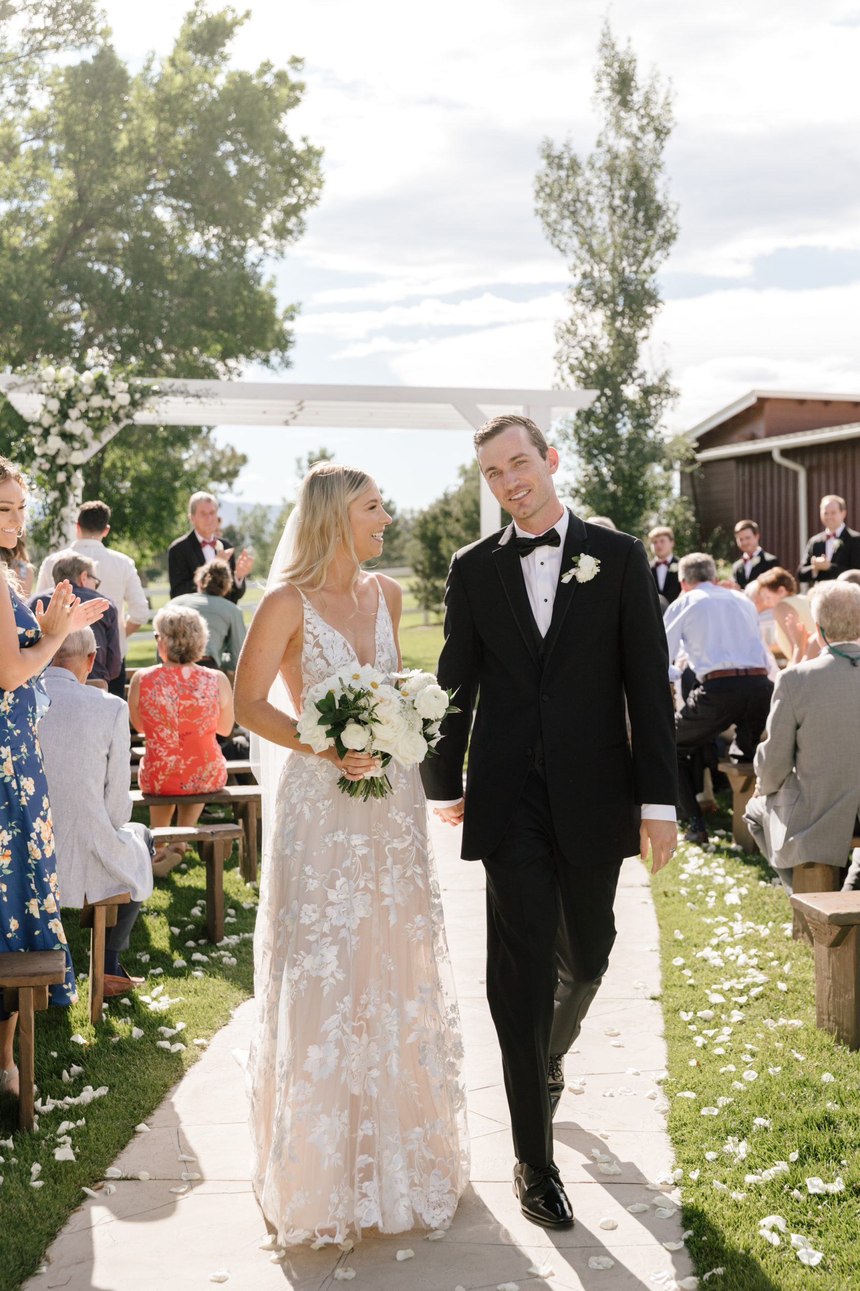 Summer golf course wedding at the Barn at Raccoon Creek in Colorado.